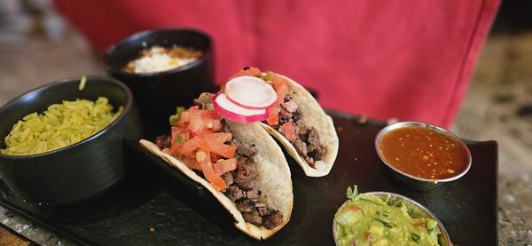 Tac/Quila signature dishes Street TacosHuitlachoche TamalGourmet Tacos